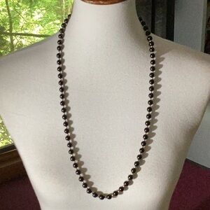 Black beaded necklace, gold tone balls between each midnight black ball, 30”